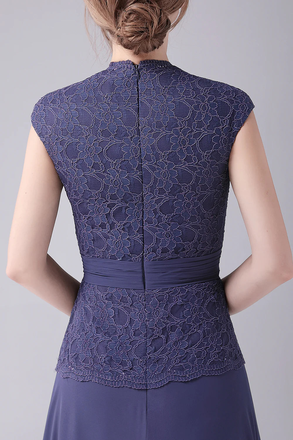 Close-up of the V-neckline and fabric detail of the formal dress.