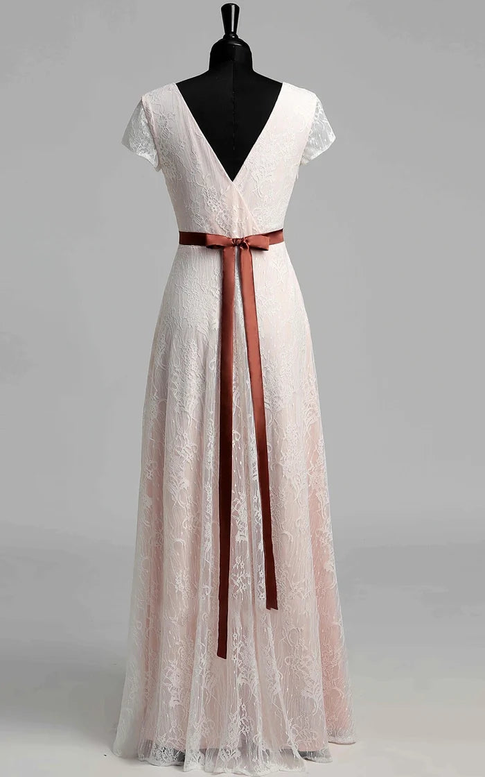 Back view of a pleated lace long wedding dress with short sleeves.