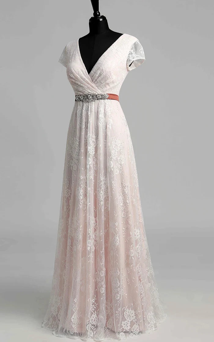 Close-up of the delicate lace detail on a V-neck wedding dress.