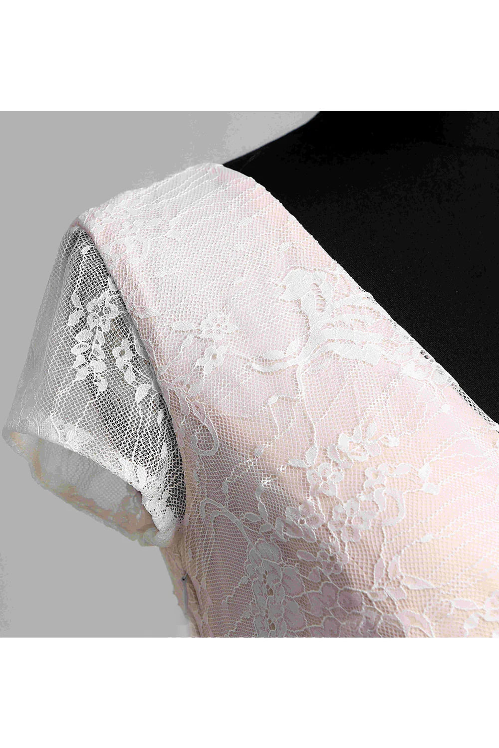 Bride wearing a V-neck short sleeve pleated long lace wedding dress.