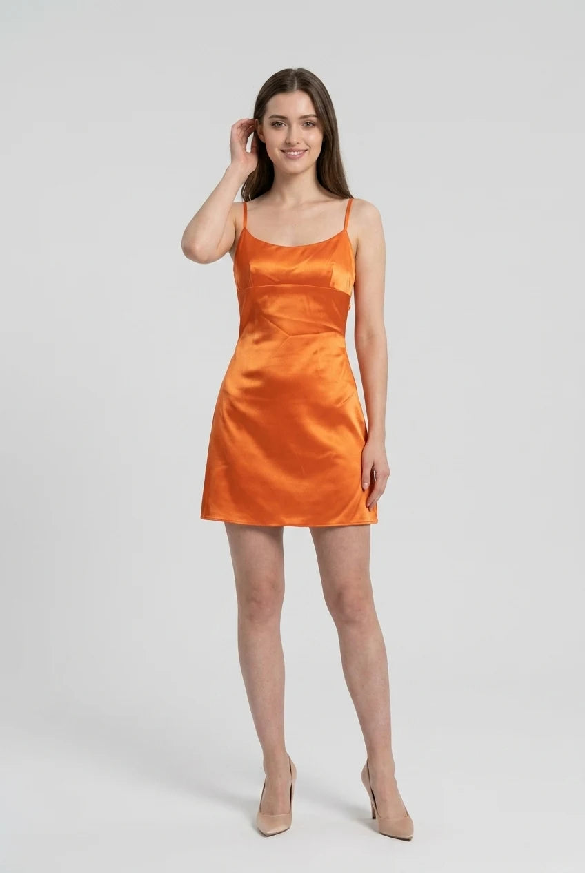 Full length view of the orange A-line bridesmaid dress.