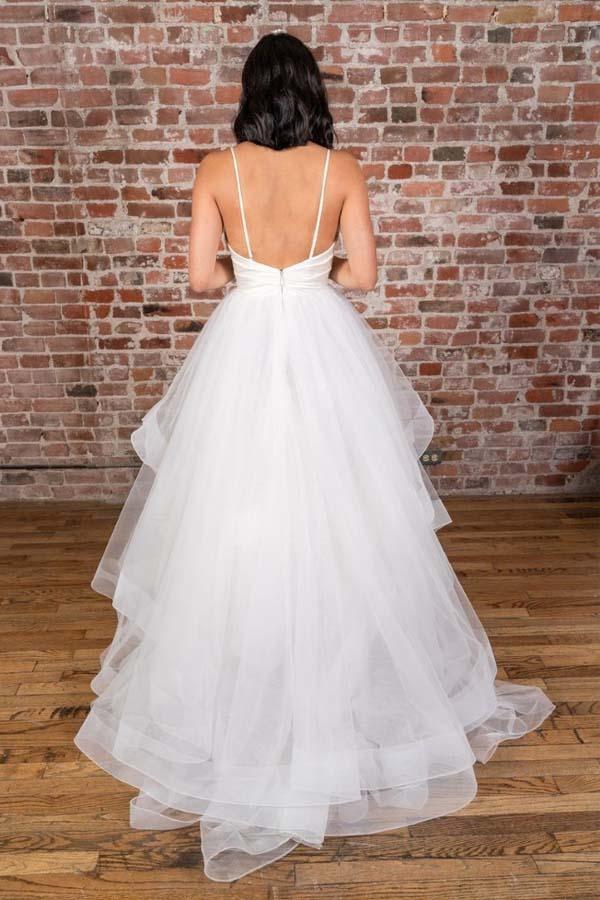 Back view of a floor-length white satin wedding dress with V-neck and straps.