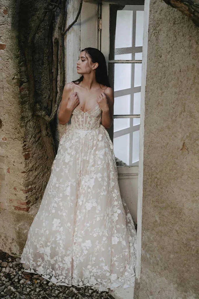 Back view of a bohemian wedding dress with delicate lace details.