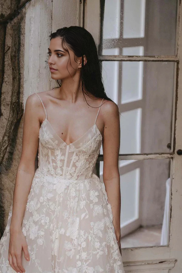 Side view of an elegant A-line bohemian wedding dress.