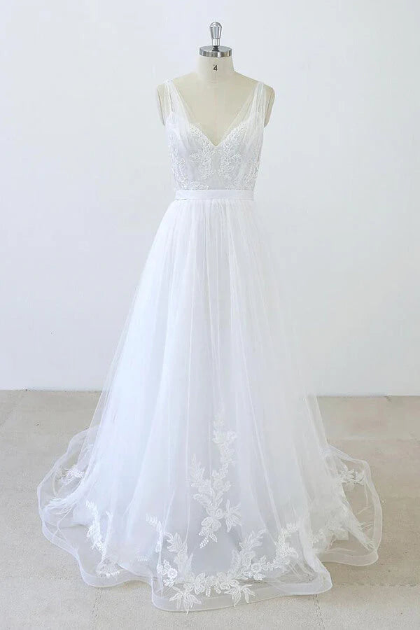 Elegant A-line V-neck sweetheart tulle wedding dress with ruffle appliques, front view.