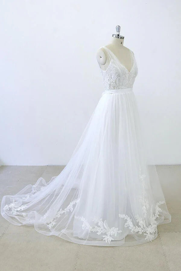 Side view of a bride wearing an A-line V-neck sweetheart long wedding dress.