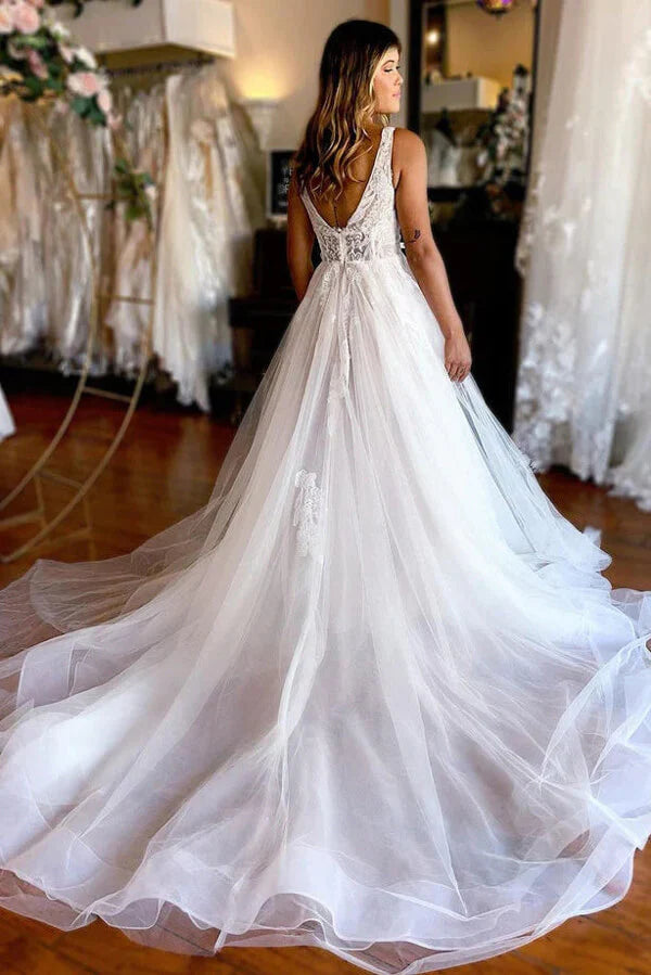 Full view of A-line V-neck beach wedding dress with lace details.