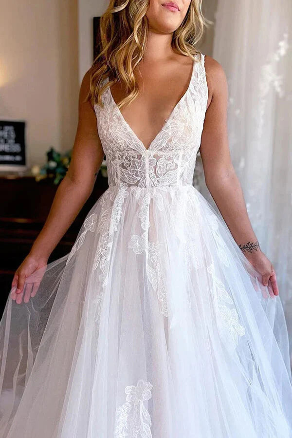 Close-up of lace appliques on a tulle A-line wedding gown.