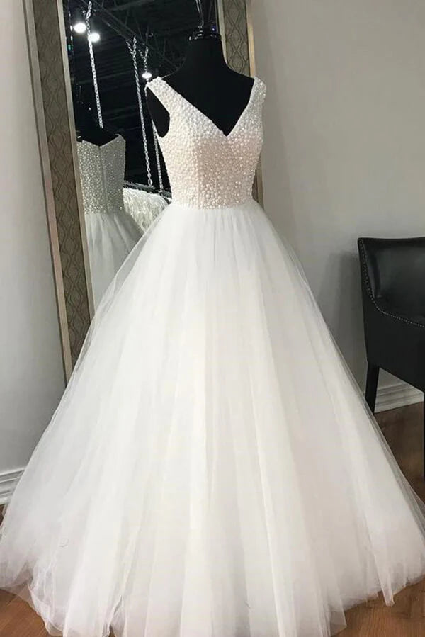 Elegant A-line tulle wedding dress with V-neck and beading.