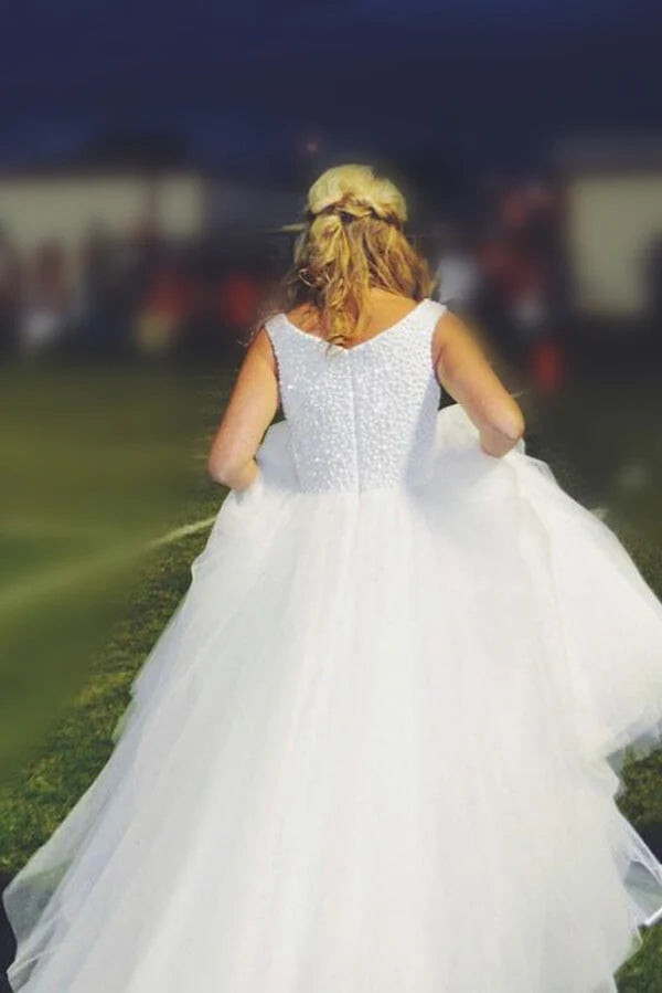 Close-up of the beaded details on an A-line tulle bridal gown.