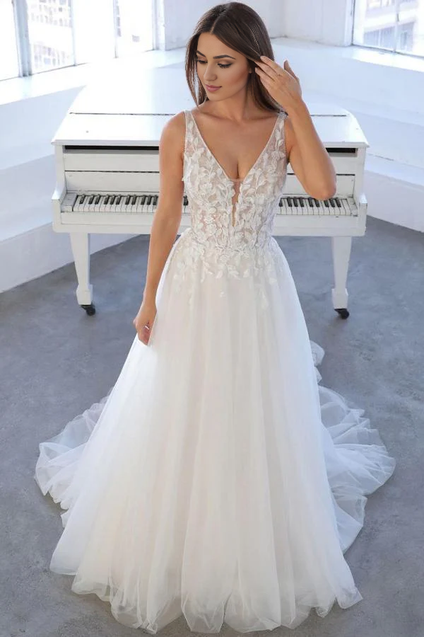 Elegant A-line V-neck wedding dress with tulle and lace details.