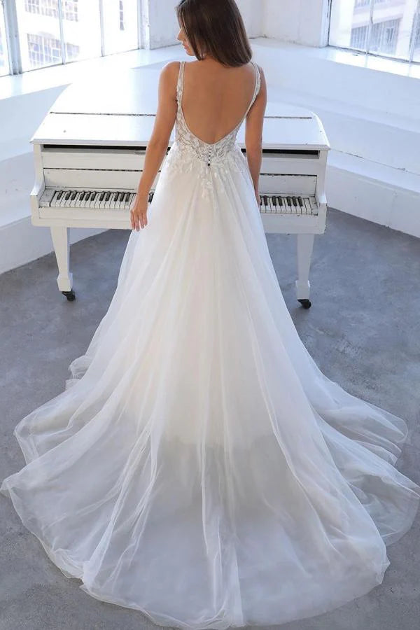 Back view of a long A-line wedding dress featuring a V-neck and lace.