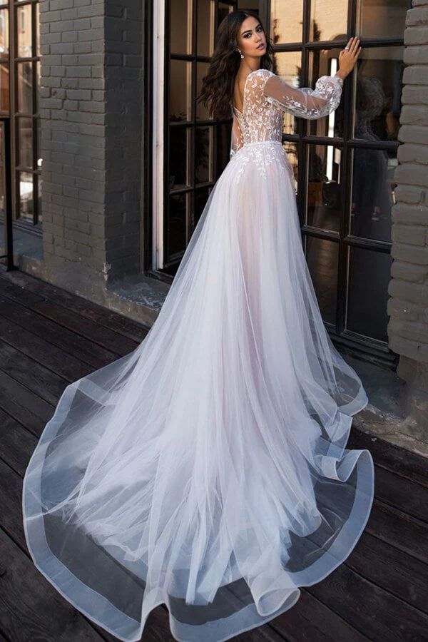 Back view of A-line wedding dress showcasing chapel train and lace details.