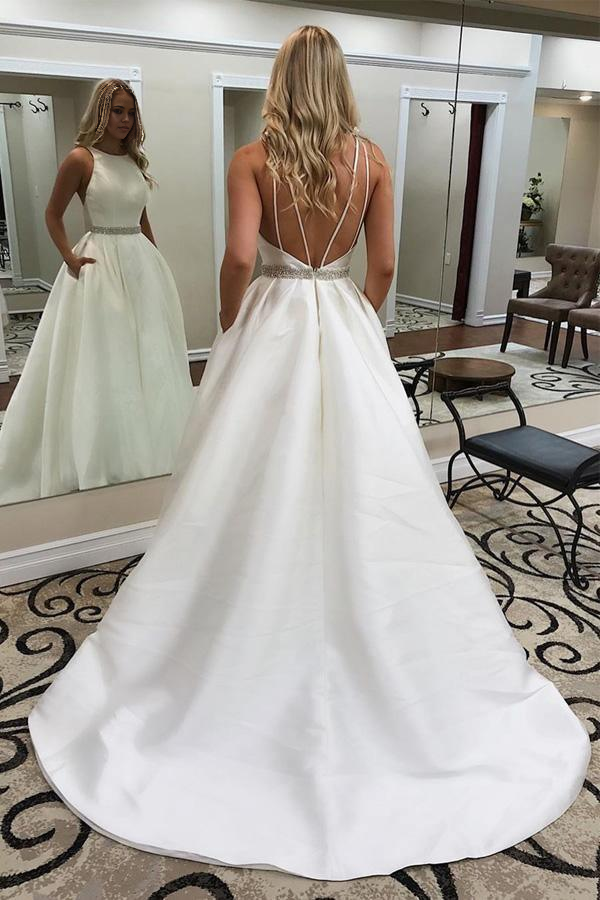 Elegant A-line V-neck wedding dress with sweep train and pockets.
