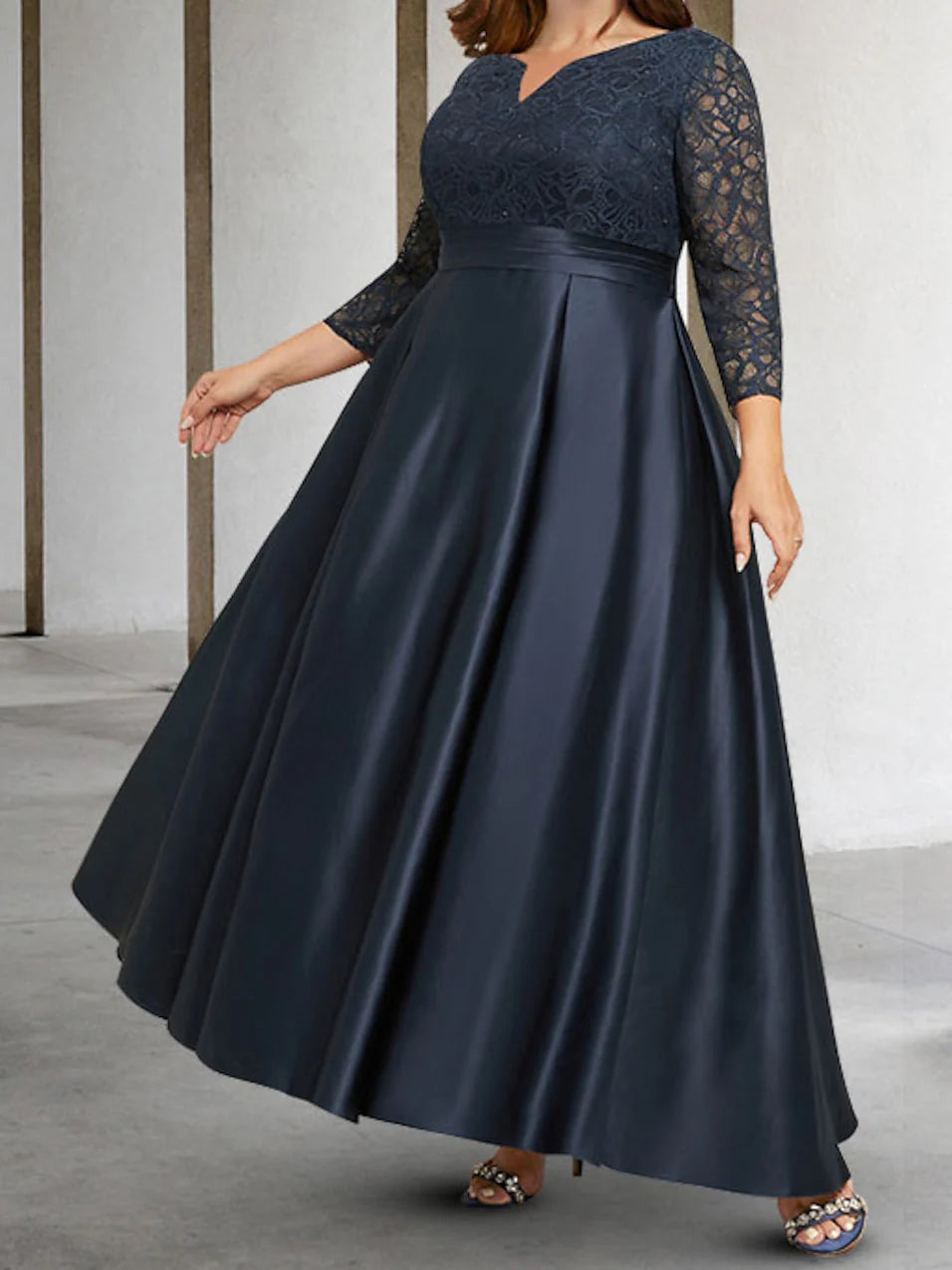 Front view of an A-line applique long sleeve mother of the bride dress.