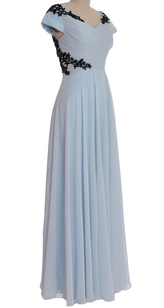 Side profile of a woman wearing a sophisticated V-neck formal dress.