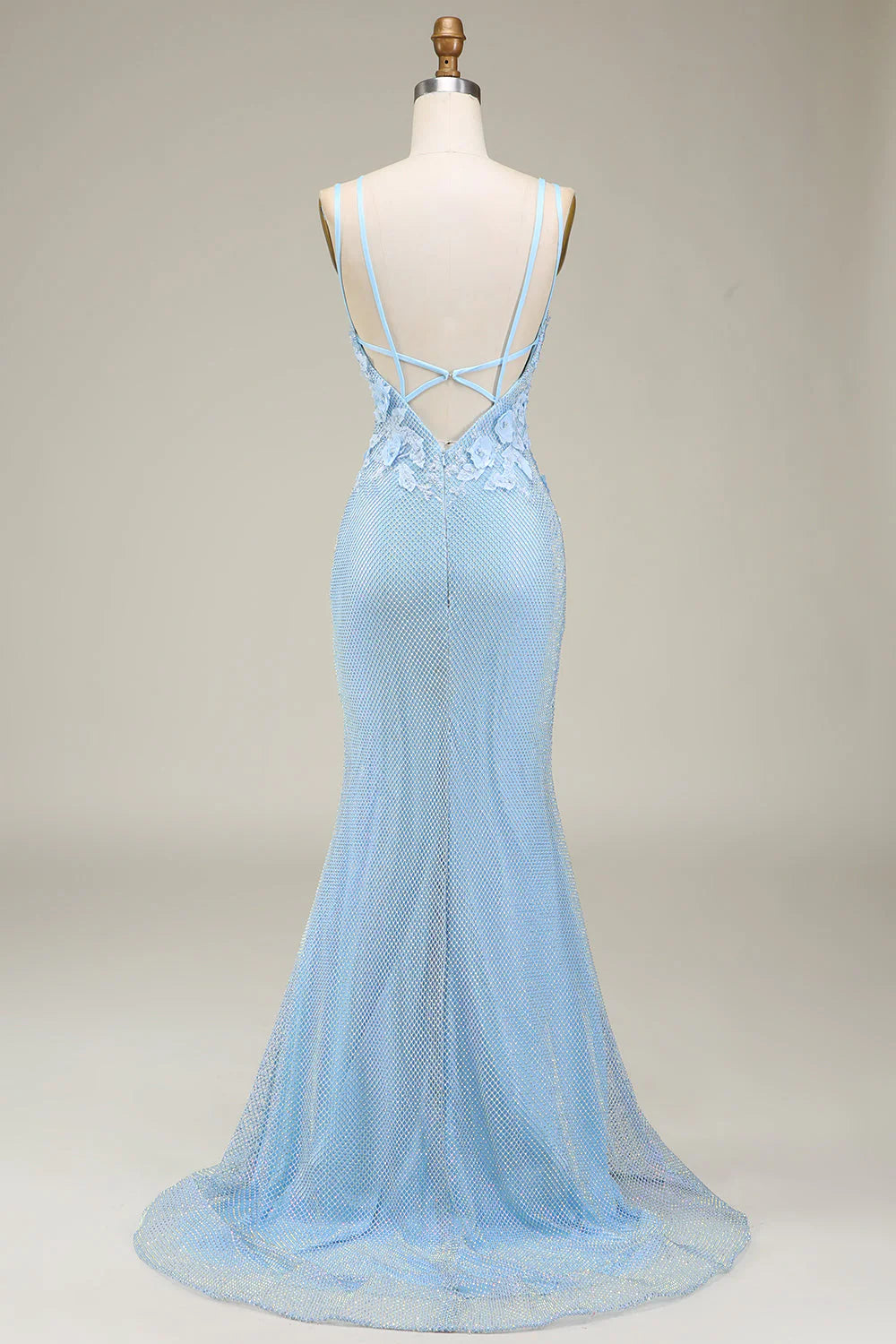 Elegant light blue mermaid gown, side view showcasing appliques.