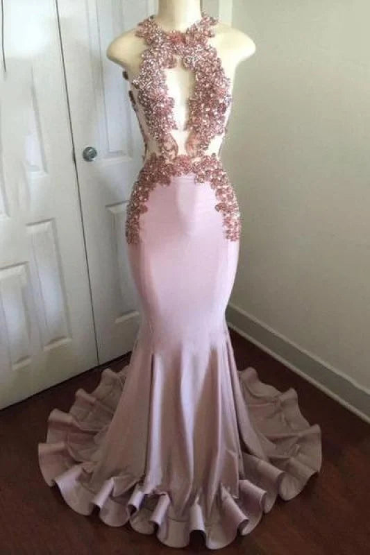 Elegant mermaid prom dress with intricate appliques and open back.