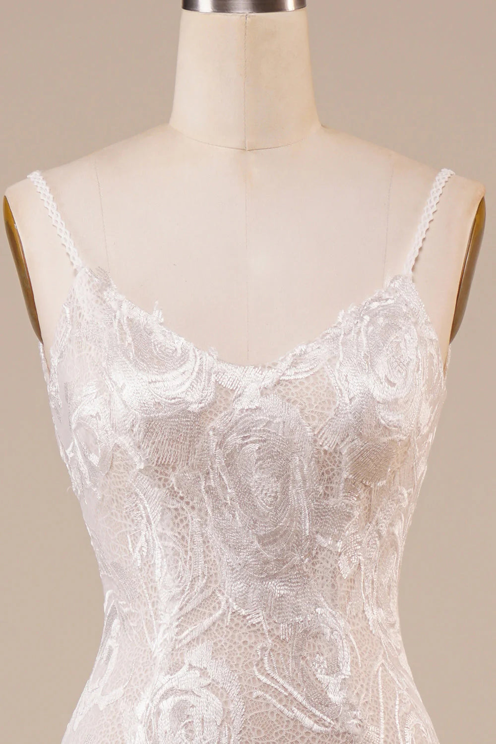 Side view of the ivory mermaid wedding gown, showcasing the sweep train.