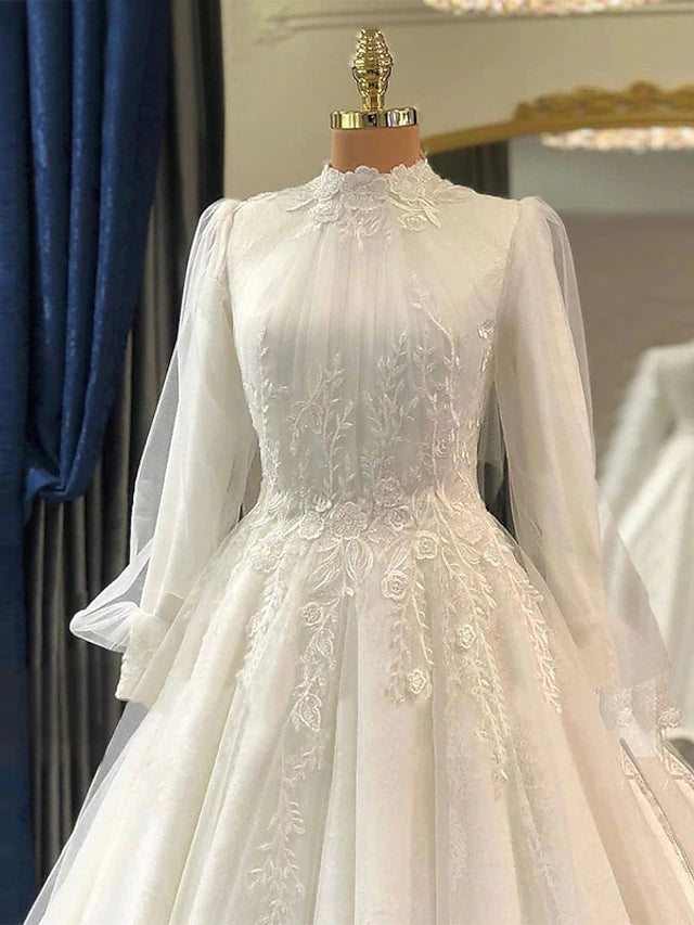 Close-up of the lace and applique details on a vintage wedding dress.