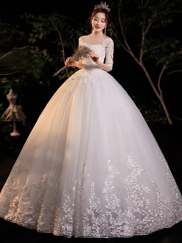 Close-up of the delicate lace and applique embellishments on the bodice of the formal dress.
