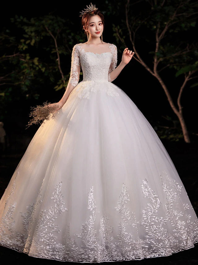 Front view of the formal engagement dress, featuring a graceful illusion neck and half sleeves.