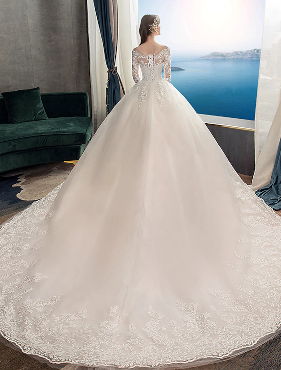 Full length view of a formal bridal gown with a sweeping train.
