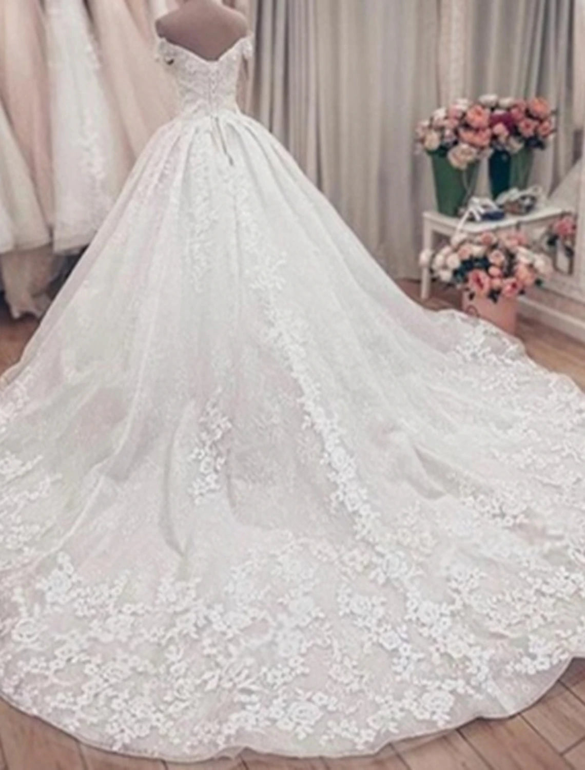 Back view of the ball gown wedding dress showcasing the chapel train.