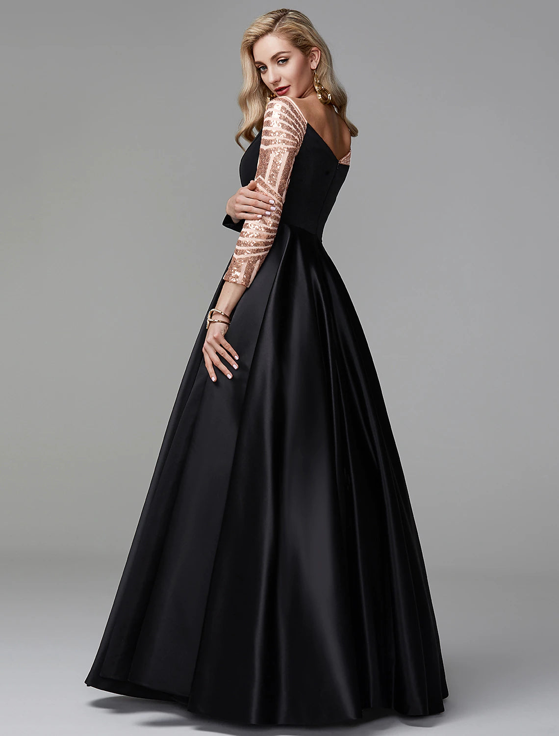 Model wearing a vintage-style off-shoulder ball gown for Quinceanera.