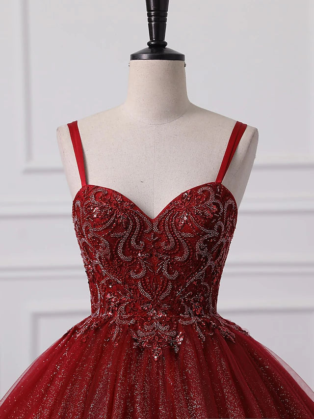 Close-up of intricate lace and beading details on the ball gown bodice.