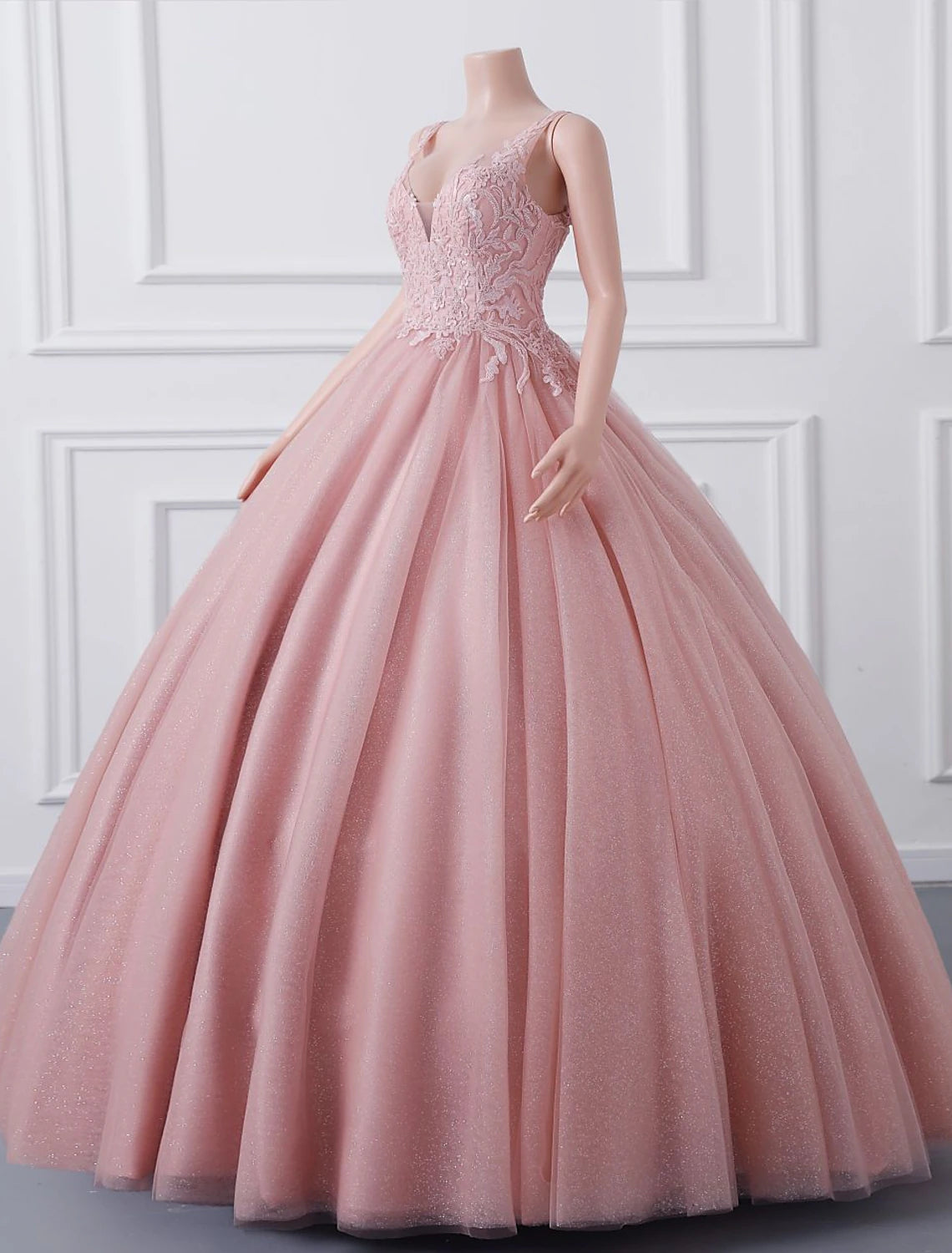 Flowing tulle skirt of the floor-length Quinceanera dress.