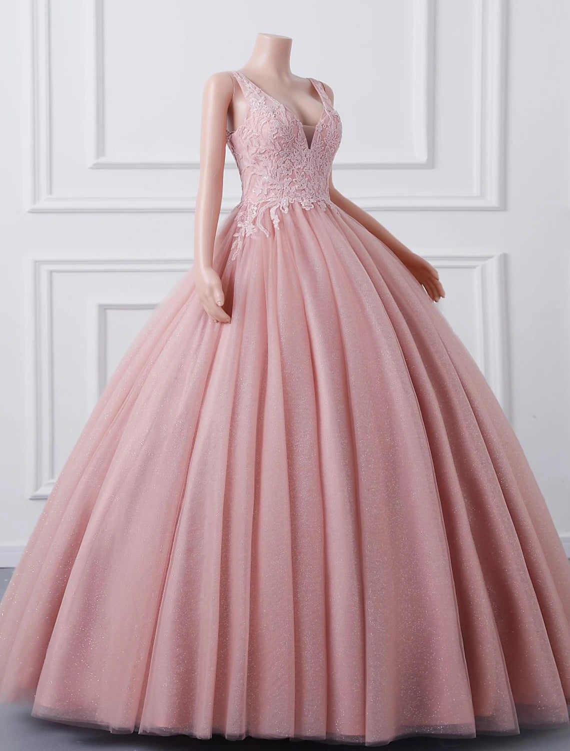 Model posing in the sparkling sequin-embellished Quinceanera dress.