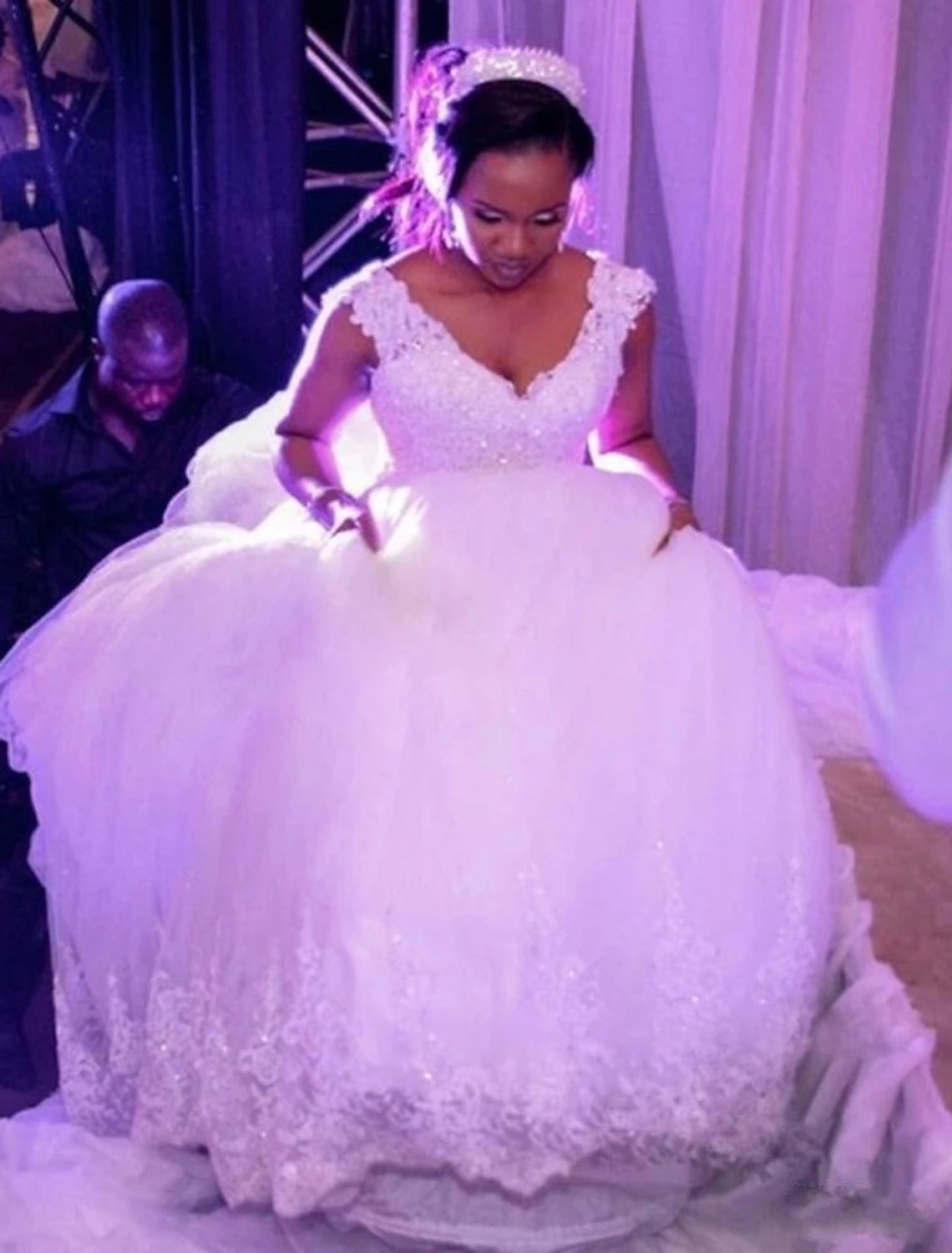 Close-up of the lace and beading appliques on the bodice of the wedding dress.