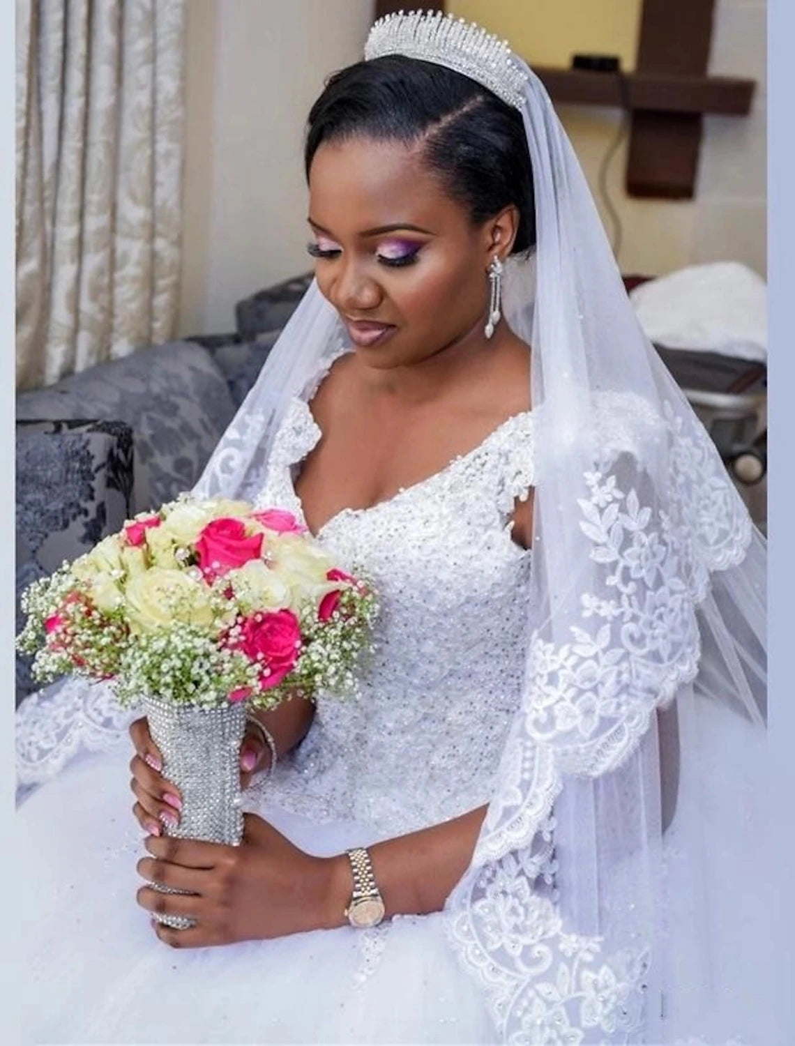 Side profile of the ball gown wedding dress, highlighting the silhouette and cap sleeves.