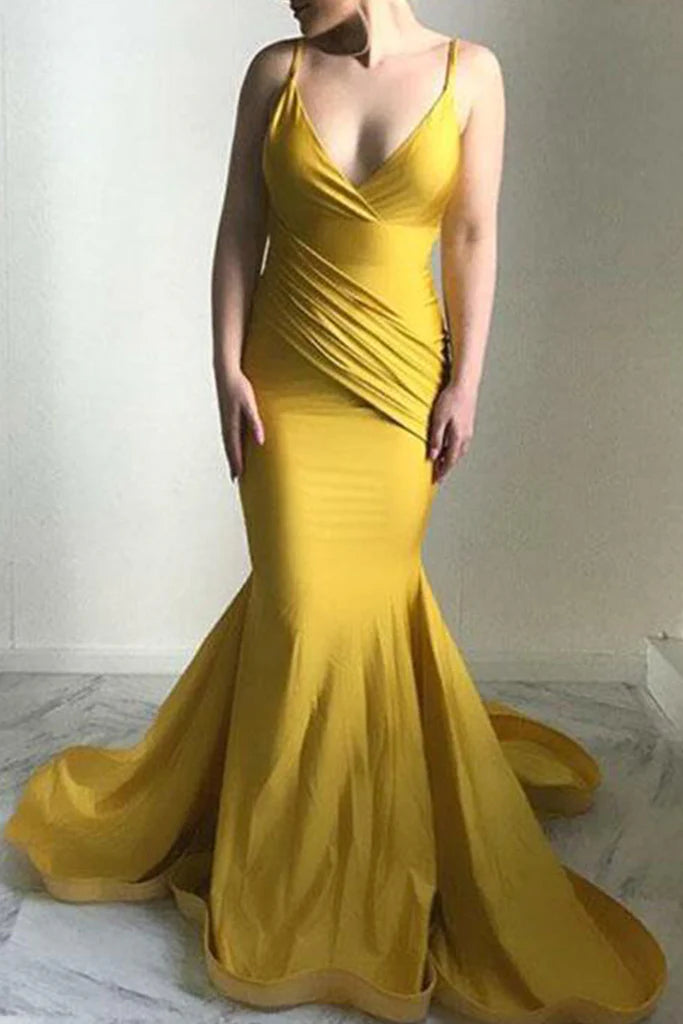 Woman wearing an elegant V-neck halter ball gown in a formal setting.