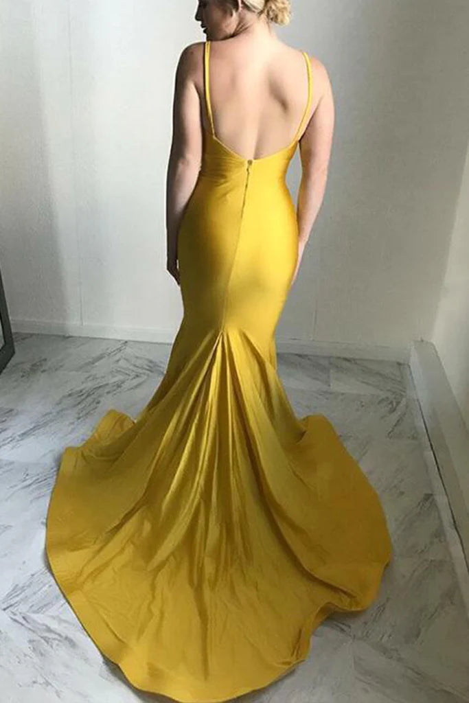 Back view of a woman in a V-neck halter formal evening dress.