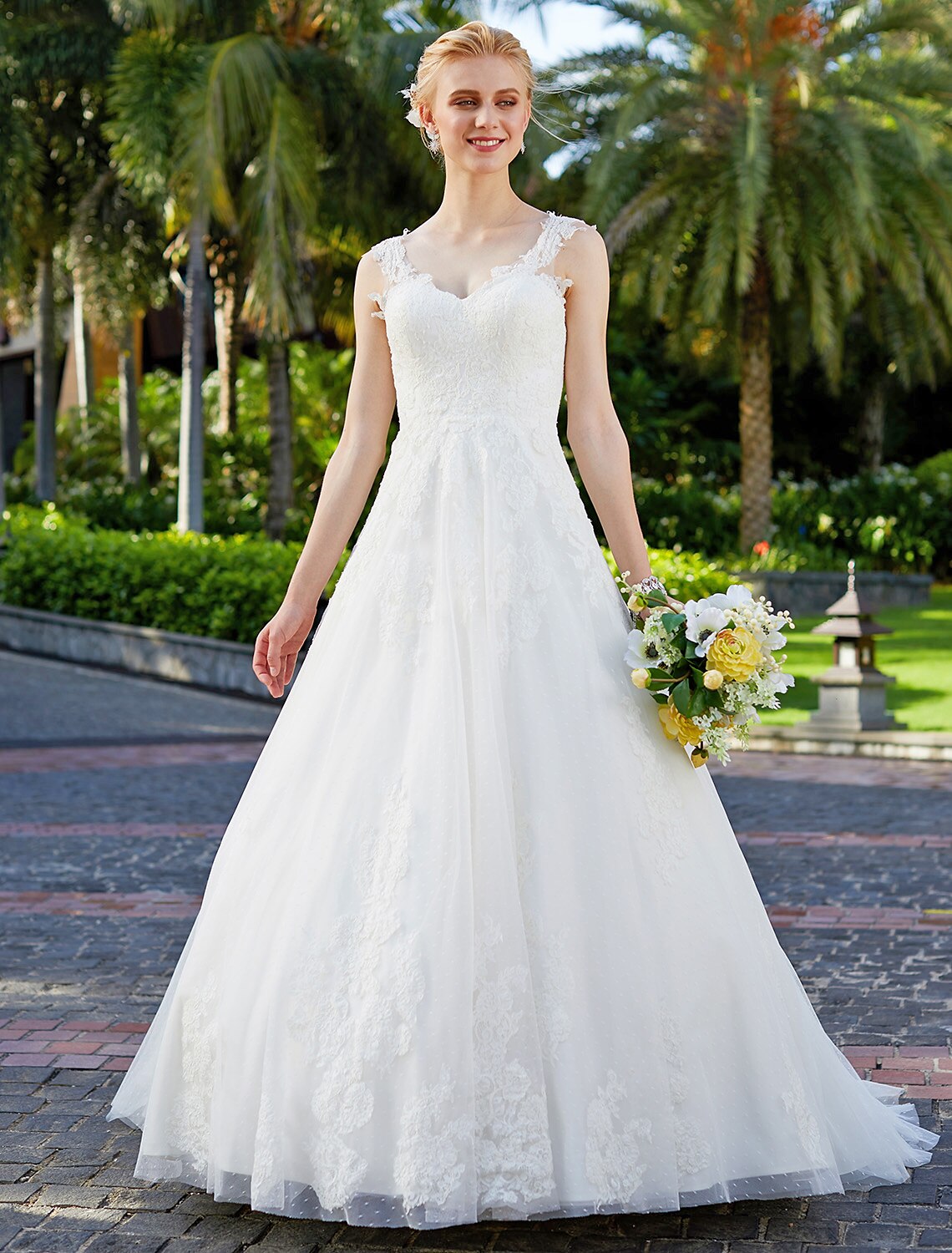 Elegant V-neck ball gown wedding dress with lace appliques.