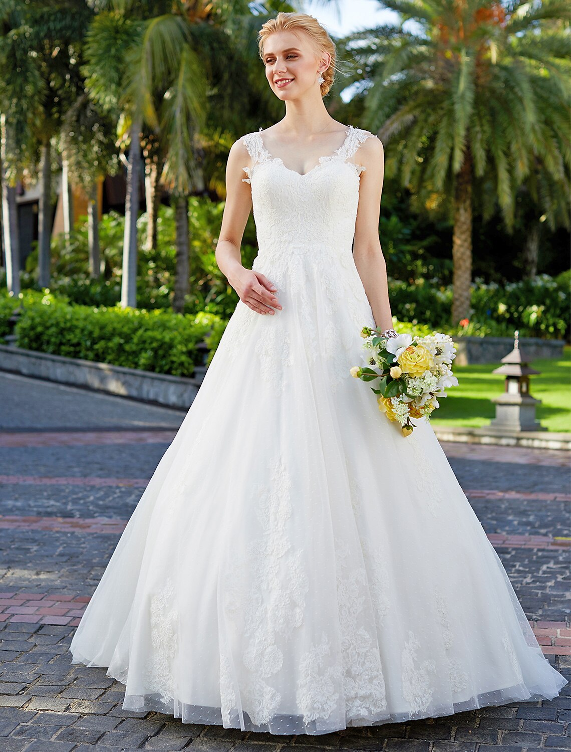 Back view of floor-length tulle and lace wedding gown.