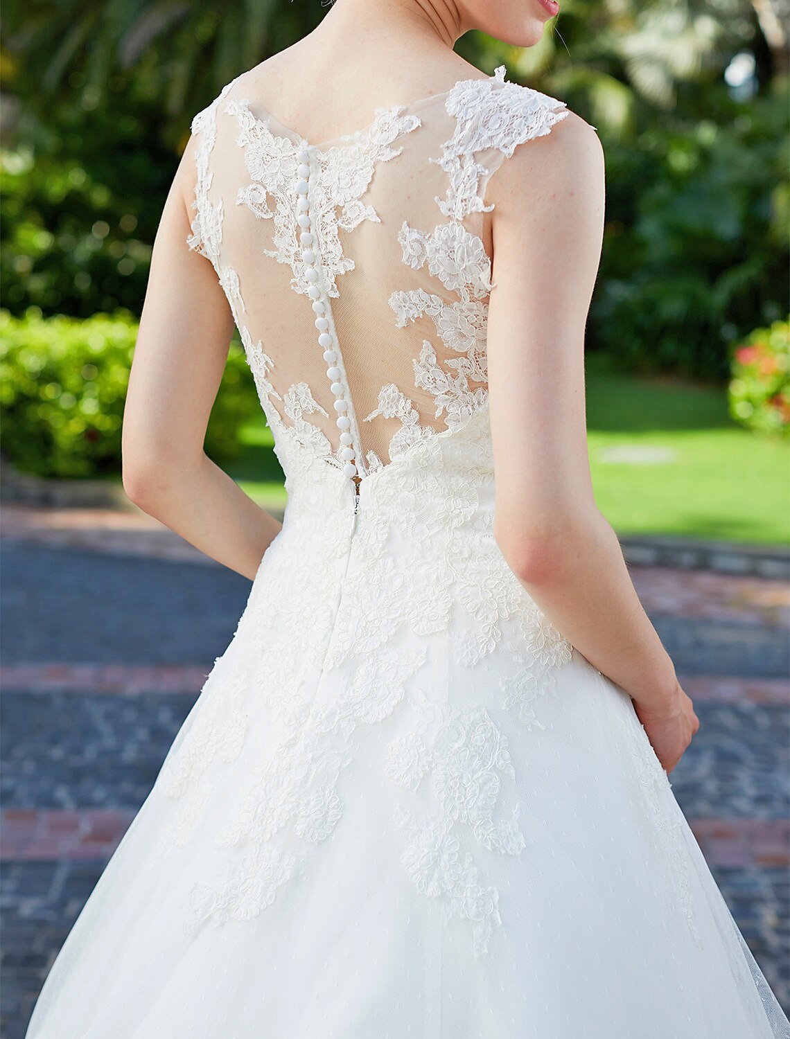 Full view of a romantic bridal gown with regular straps.