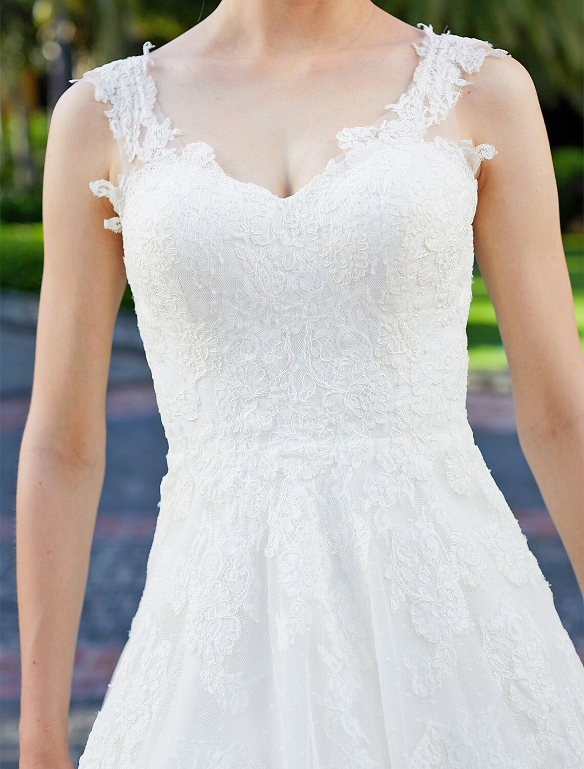 Detailed view of the tulle skirt and lace overlay on a wedding dress.