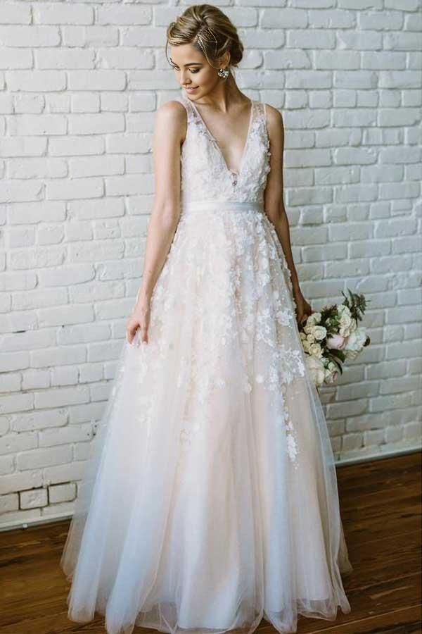 Elegant ivory A-line V-neck wedding dress with lace applique.