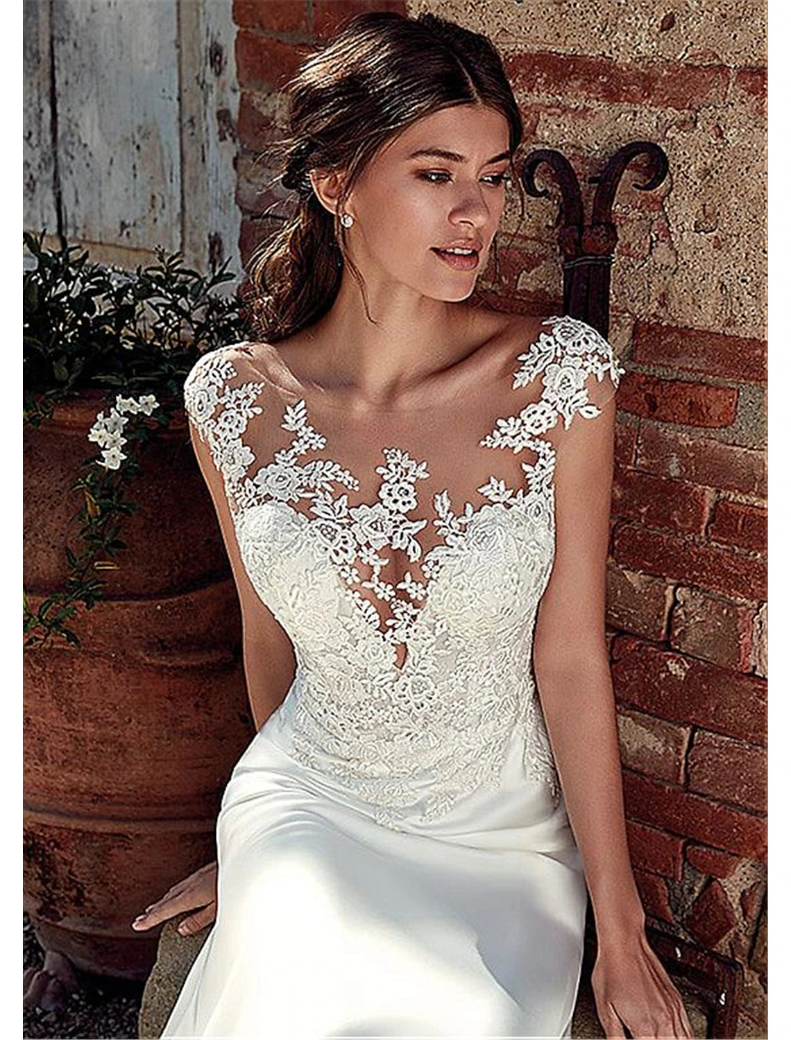 Full length view of the chiffon wedding dress with intricate appliques.