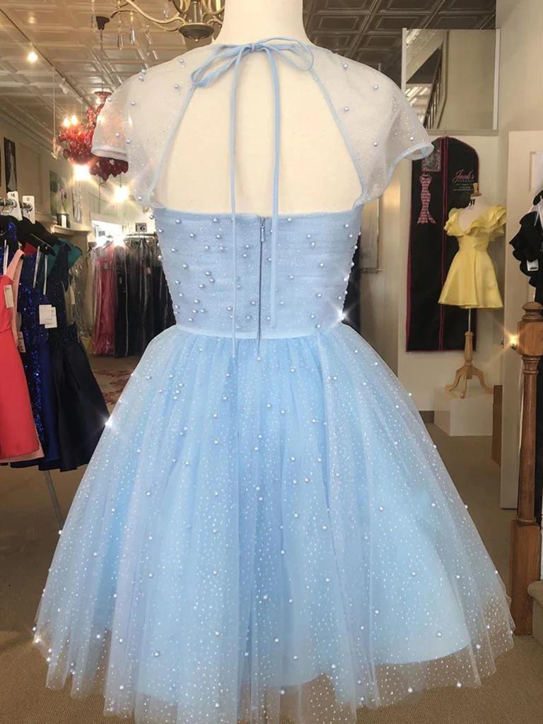 Back view of a short beaded A-line prom dress with cap sleeves.