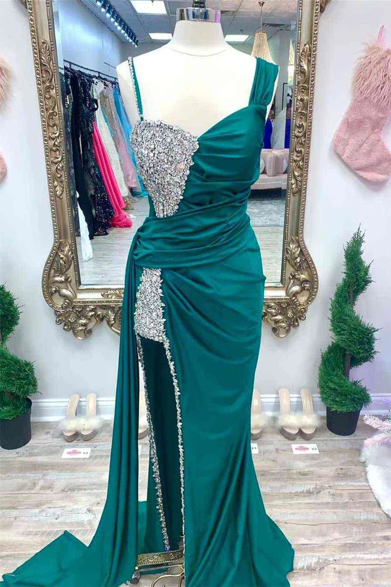 Woman showcasing the beaded asymmetrical long evening dress.