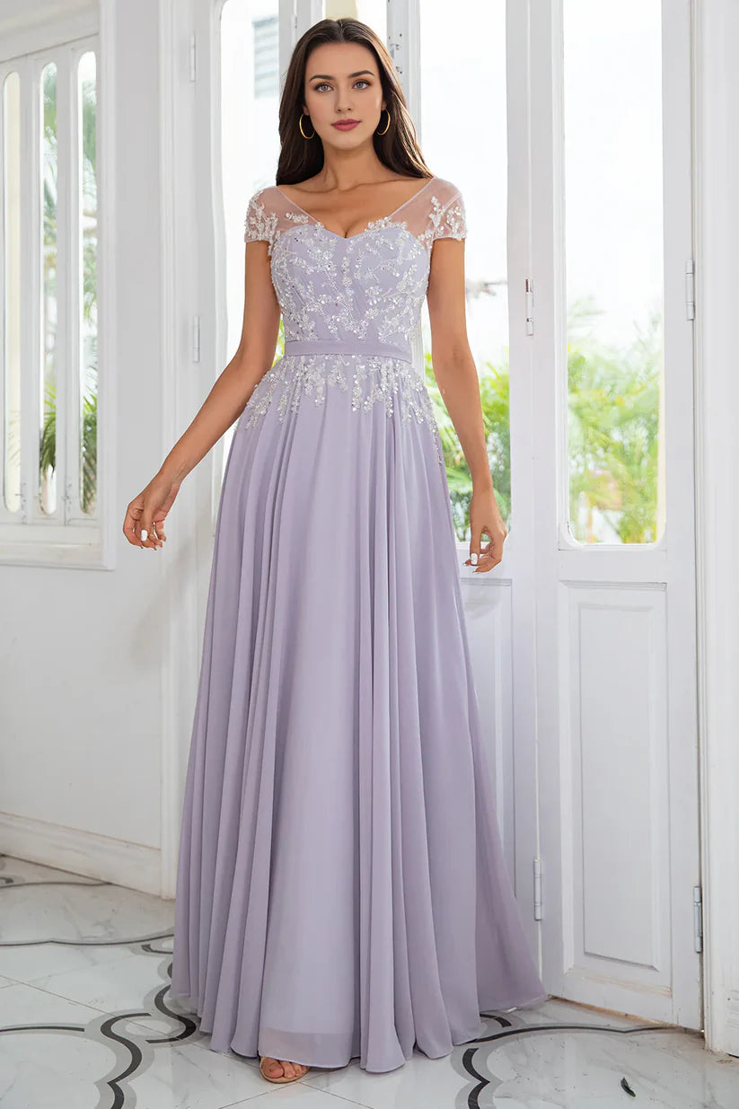 Model showcasing the elegant V-neck beaded chiffon dress.