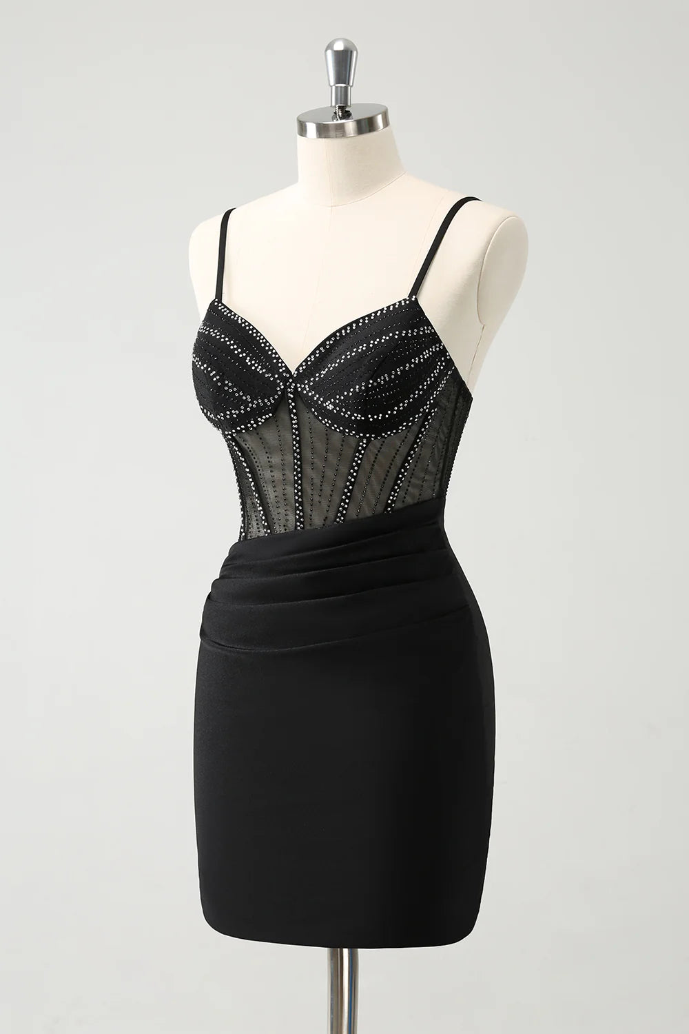 Back view of a black corset dress with beaded details.