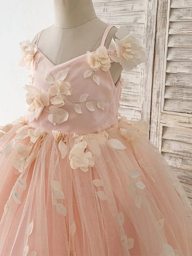 Side view of a girl wearing the white satin princess dress with floral details.