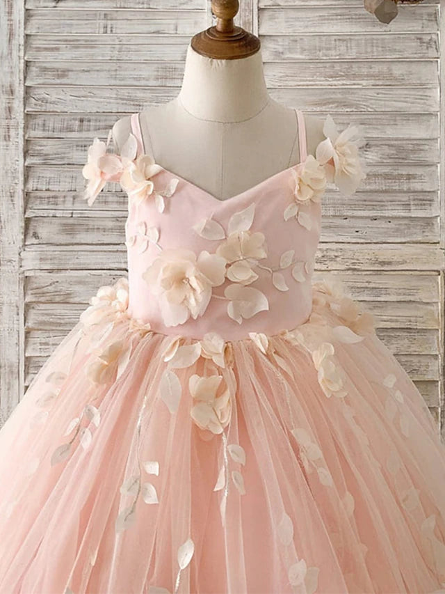 Close-up of the floral beading and satin fabric on the princess dress.
