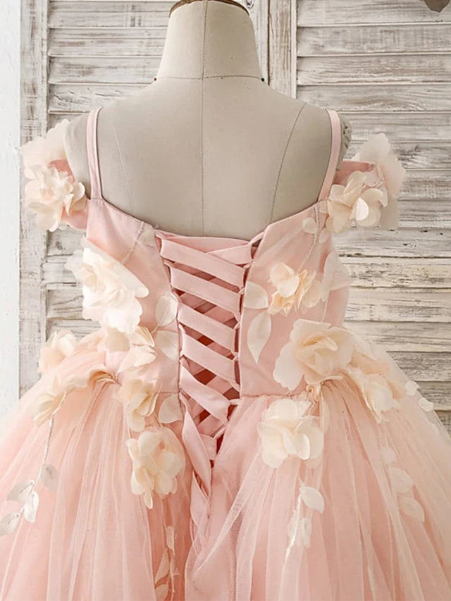 Girl posing in the white princess flower girl dress, highlighting the floor length.