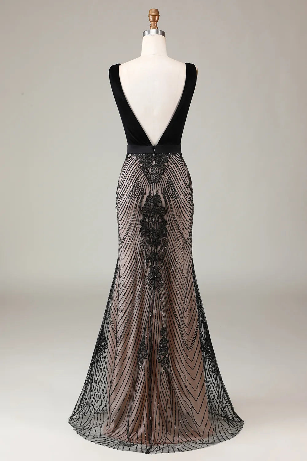 Close-up of the deep V-neckline and sparkling beading on the mermaid dress.